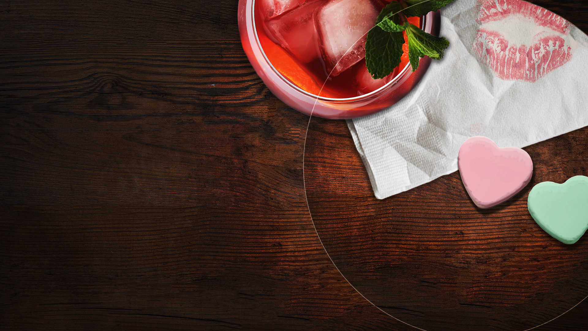 A cocktail is in the left top corner, a napkin with a kiss mark is in the right top corner, 2 conversation hearts are on a table as well as some coins.